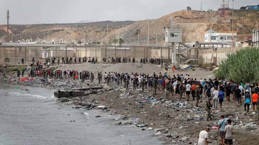 Spain says migrants are returning from Ceuta after 57 die in border rush